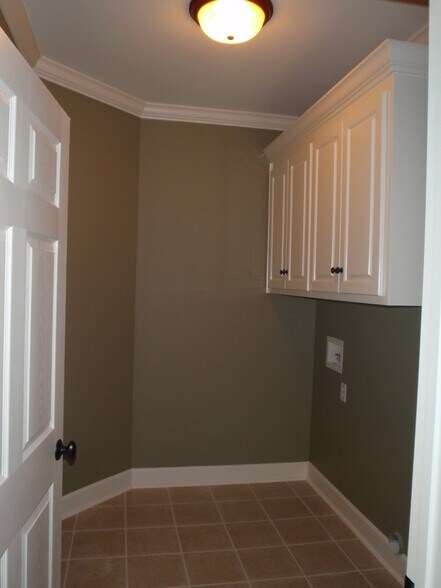 washer &amp; dryer hook ups and additional storage - 409 Redbud Cir