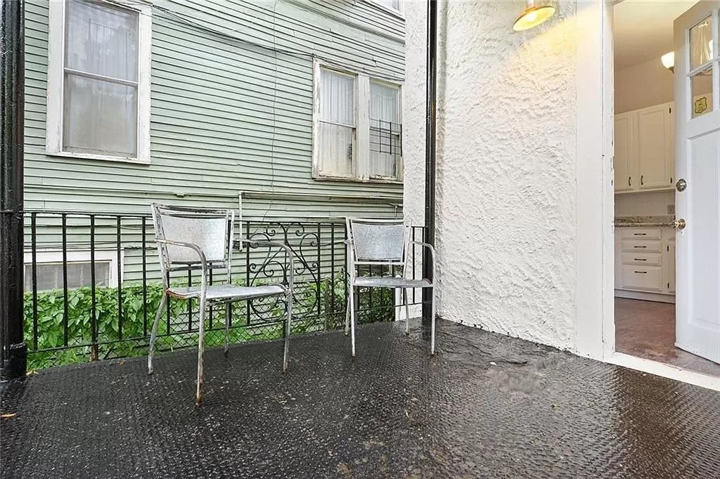 REAR ENTRANCE THROUGH BACK PORCH LEADS TO THE KITCHEN - 8 Neron Pl