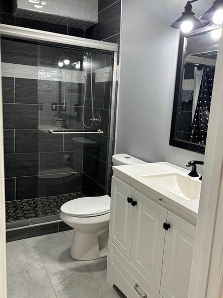 Glass shower and vanity - 4155 Round Stone Dr