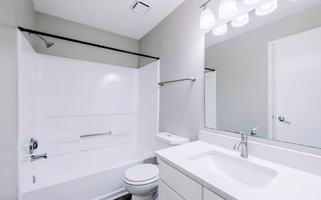 Building Photo - Spacious 2-Bedroom Elite Apartment with Private Balconies & Washer/Dryer