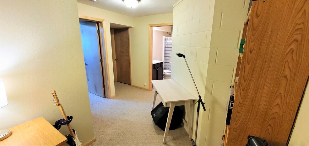 Lower level common area. (photo from neighboring unit with the same layout) - 1756 St Joseph St