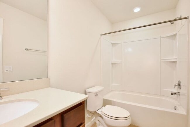 Building Photo - Immaculate Townhome · Dual En-Suite Bedrooms + Flex Loft · Cable & Internet Included · 3.5 Miles ...