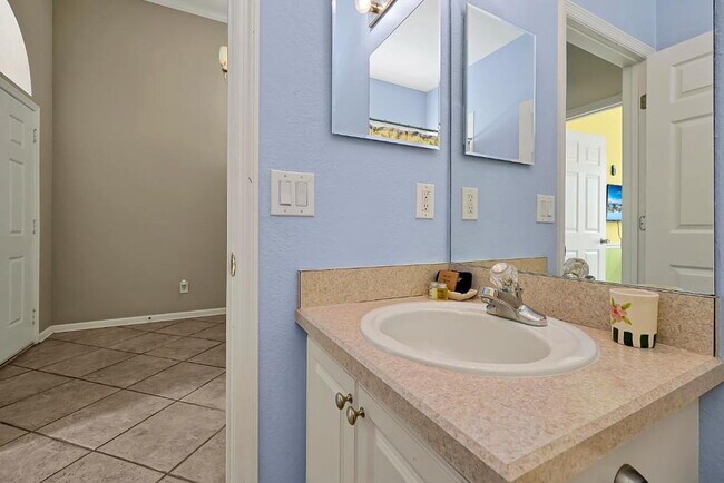 Building Photo - "Stunning 3BR Orlando Home with Private Screened Pool, Spa & Spacious Living Areas"