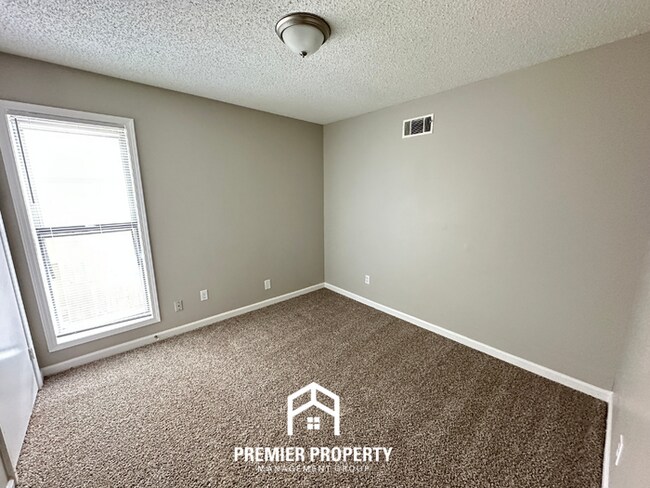 Building Photo - Quiet 3BR/2BA Cove Near Southwind | Soaring Ceilings & Floor-to-Ceiling Stone Fireplace