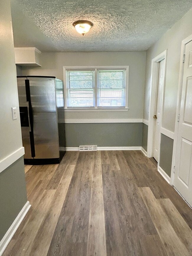 Building Photo - 3/2 with Fenced Yard; In-town and Near an ...