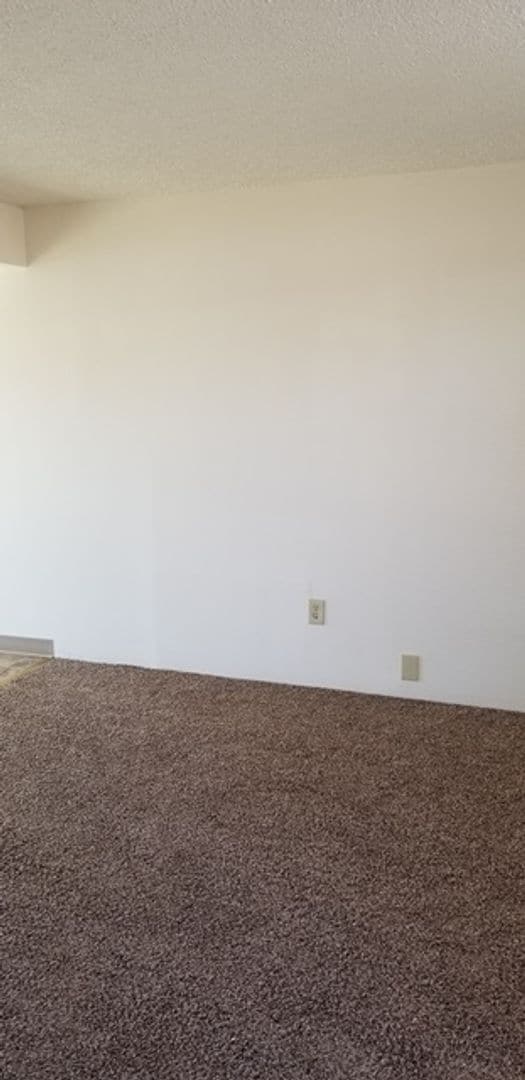 Building Photo - End unit in 8-plex complex