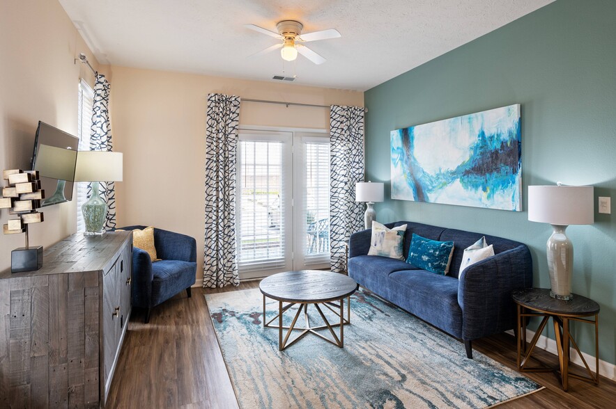 Spacious Living Room with Hardwood-Style Flooring - Hartshire Lakes Apartments