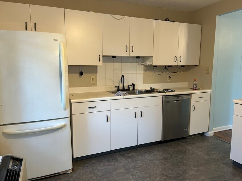 Kitchen front view sink,dishwasher,fridge - 115 Polifly Rd