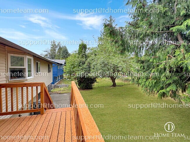 Building Photo - "Spacious 4-Bed Oasis with Granite Touches & Finished Basement in Renton!"