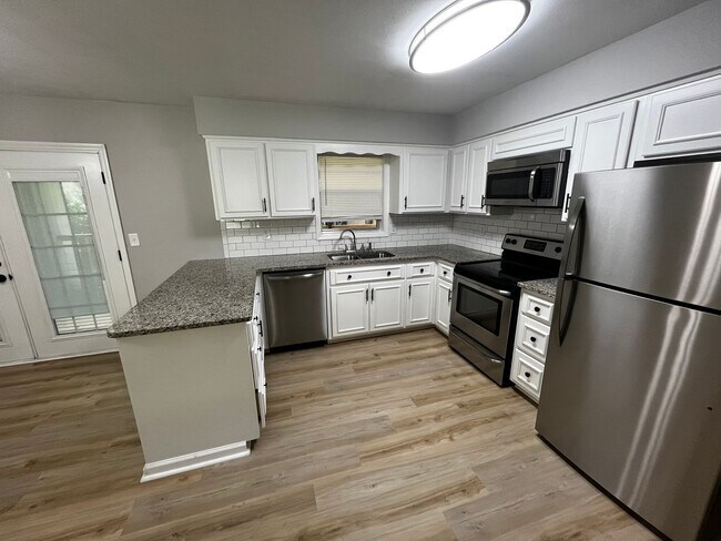 Building Photo - Must See the Sunroom off the Primary Bedroom!