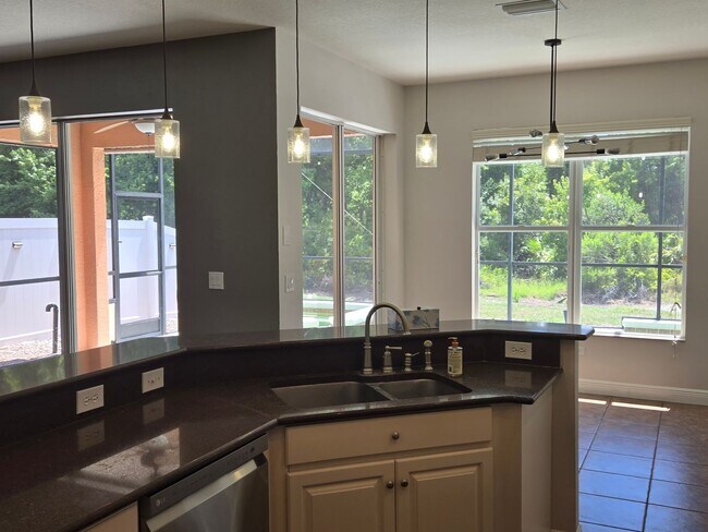 Building Photo - Freshly Painted 4BR/2BA Pool Home with Screened Pool & Spa – Move-In Ready!