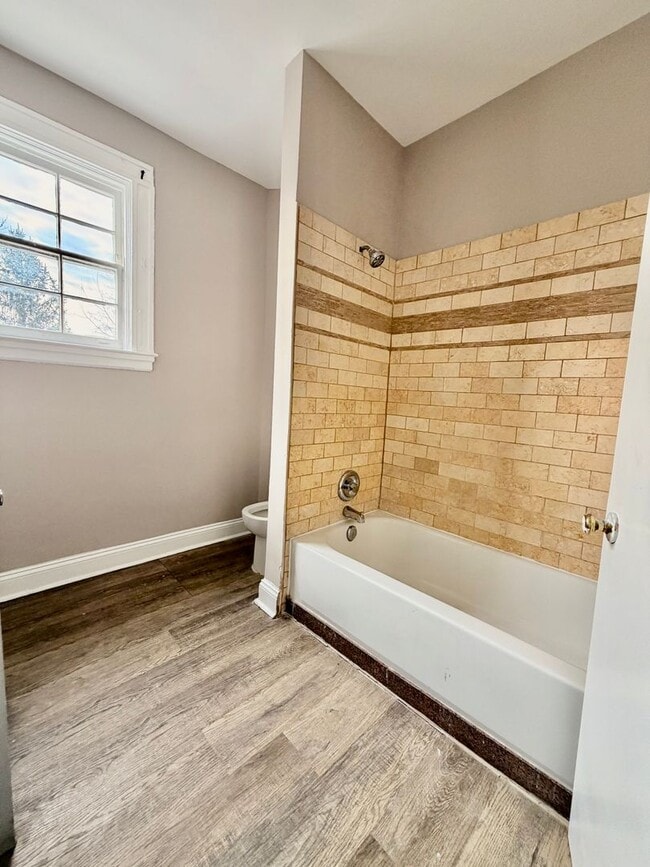 Building Photo - Huge townhome available. Four bedrooms three bath.