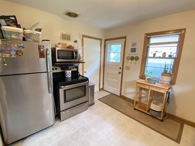 Building Photo - Charming NE Home w/ Two Car Garage