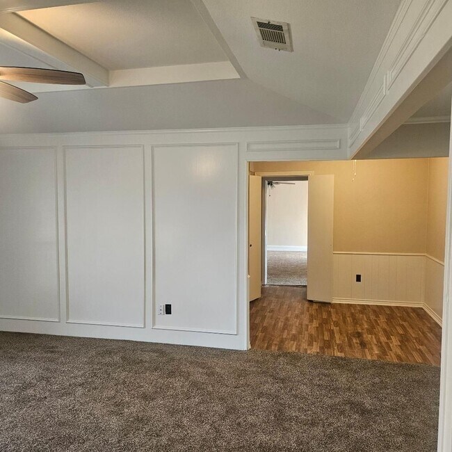 Building Photo - Three bedroom and two bathroom nicely remodeled with new flooring. Large wood fenced backyard