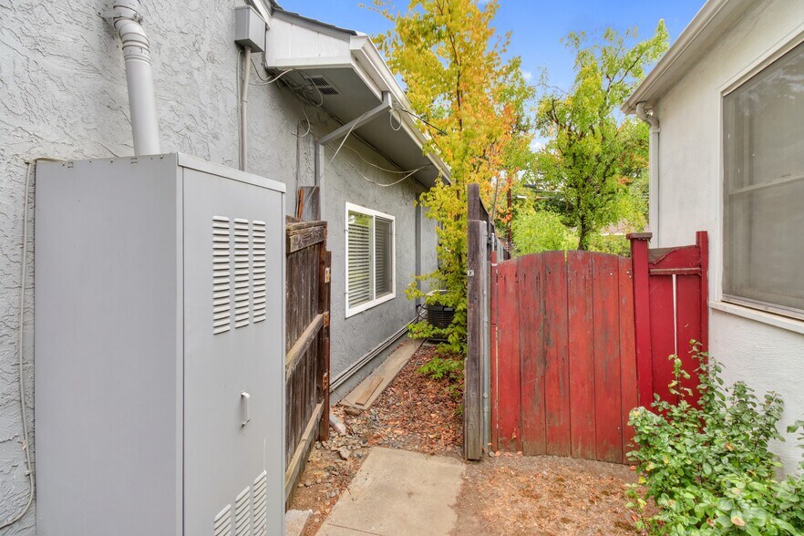 Side yard storage area for bikes, BBQ, outdoor chairs, etc. - 47 Fallon Ln