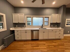 Eat-in kitchen with granite countertops and stainless steel appliances - 111 Falcon St