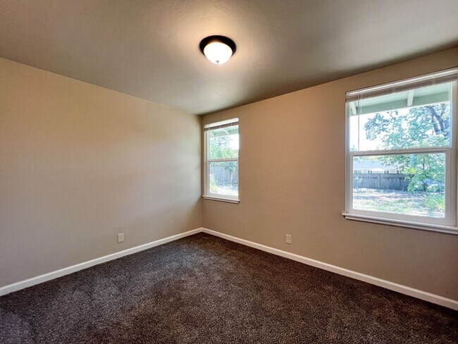 Building Photo - Freshly Renovated 3 Bedroom Home with Large Fenced Yard & Double Garage