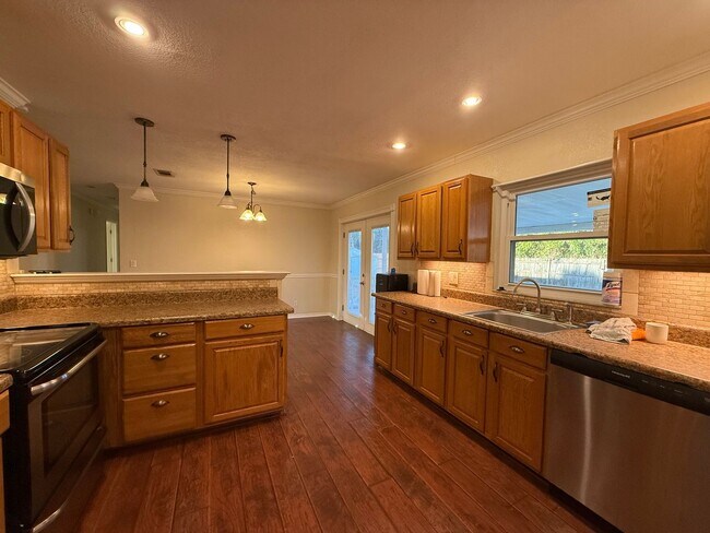 Building Photo - Beautifully updated 4-bedroom, 2-bathroom pool home