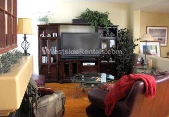 Main living space, featuring solid oak flooring, spacious media, a fireplace, etc ... - 18118 Flynn Dr