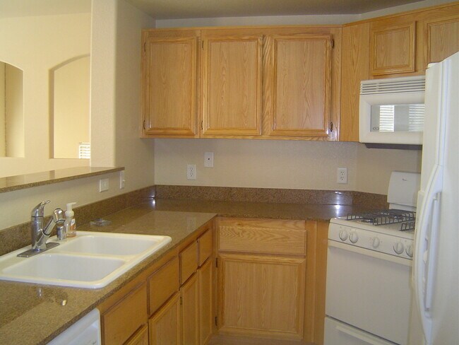 Building Photo - Move-In Ready Condo with Private Balcony & Modern Upgrades