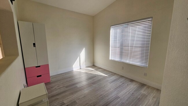 Building Photo - Partially Furnished 2/2 CONDO WITH  *BONUS DEN* & 2 CAR GARAGE!