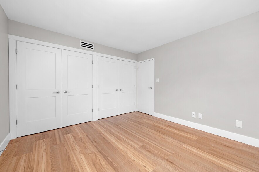 Bedroom Closet with Built In Cabinets - 20333 Detroit Rd