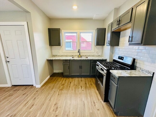 Building Photo - Lease_ Fully Remodeled 3 Bedroom 1 1/2 Bath Welcome Section 8 Call 313-429-3244