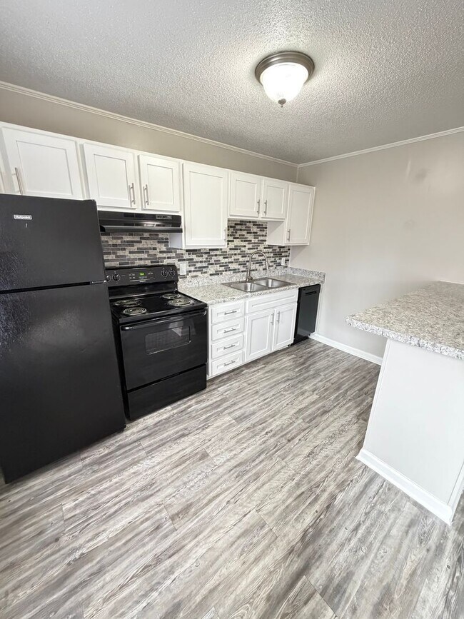 Building Photo - May Savings Are Here! Application Fee WAIVED ALL month!