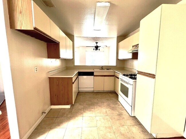 Building Photo - 2 Bedroom, 2 Bath Upstairs Condo with Private Balcony & 2-Car Garage, Gated Community, Water/Tras...