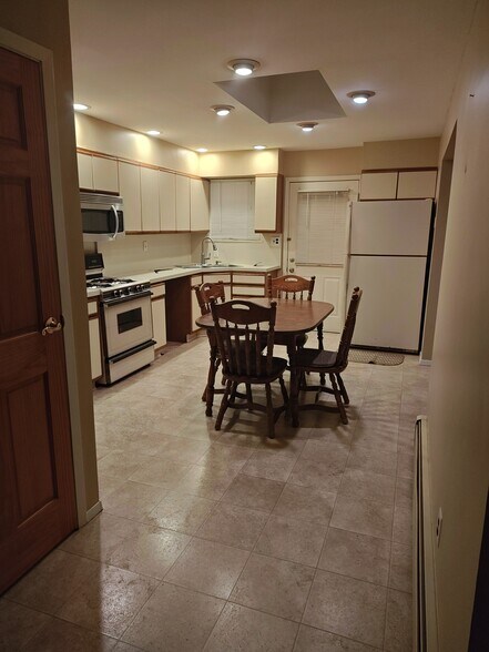 Kitchen with Door leading to large deck - 32 Scooter Ln
