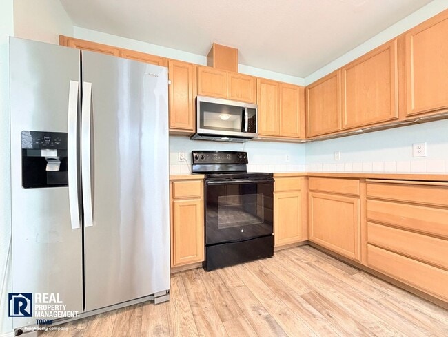Building Photo - Spacious 4-Bedroom Townhome in Alicia Meadows | Garage, Patio & Pet Friendly