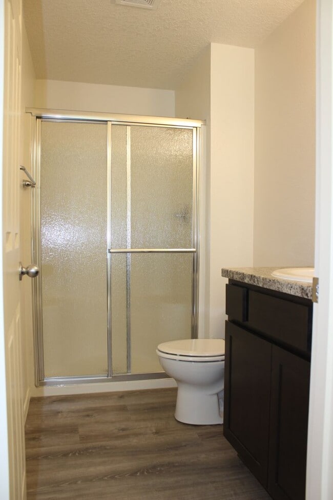 Building Photo - 4 BR, 2 1/2 BA home with fenced yard.