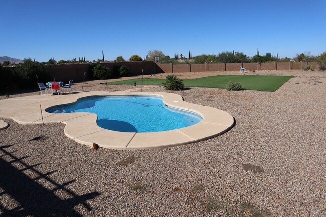 Building Photo - Home With A Pool and Much More!