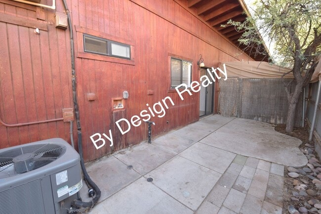 Building Photo - Charming Mid-Century Style: Vaulted Beams & Private Oversized Yard