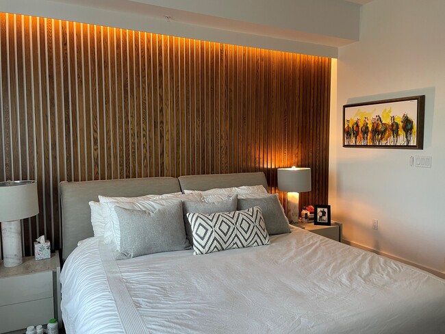 Lighted wood slats behind bed - 1111 Central Ave