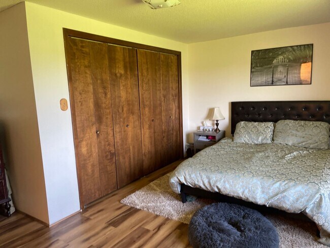 Building Photo - Spacious, four-bedroom, two-bathroom, coun...