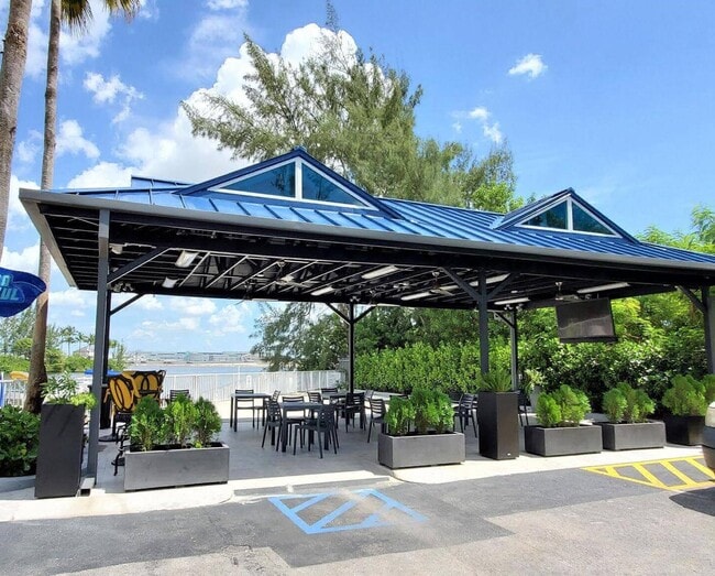 Building Photo - Rare 2/2 Corner Penthouse with Panoramic Lagoon Views from Every Room – Available Now!