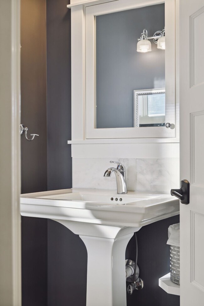 Custom handmade medicine cabinet with marble backsplash. - 924 Eleanor Ave