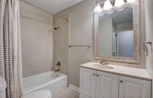 Building Photo - Welcome Home: Charming Brick Beauty with Covered Porch.