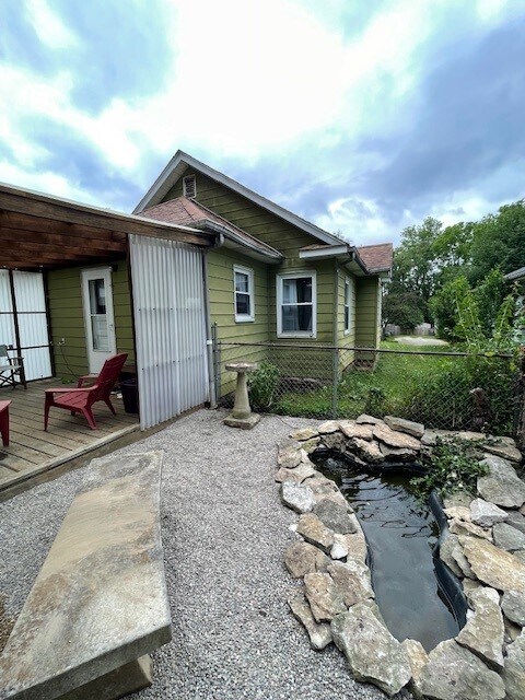 Outdoor bench, birdbath and pond. - 211 E Vermilya Ave