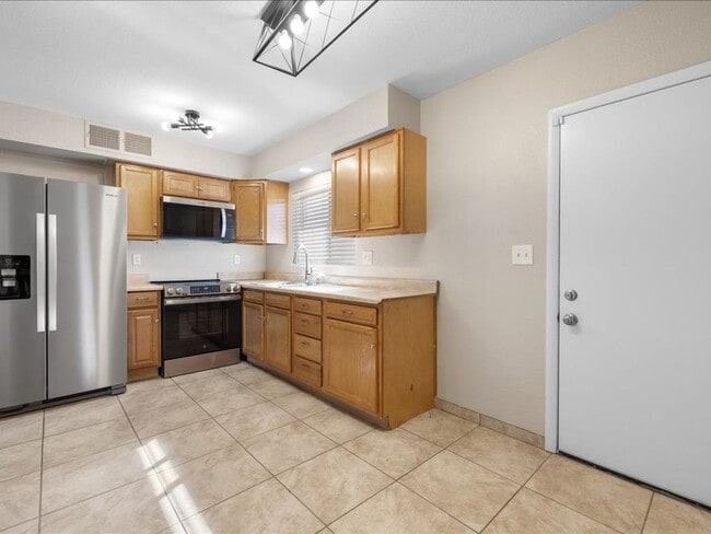 Building Photo - Two-Story Home with Brand New Appliances & Private Turf Backyard!