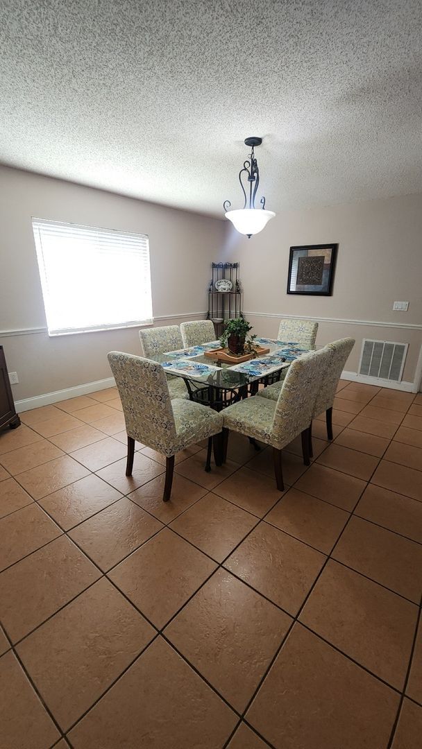 Building Photo - The Woodlands of Palm Coast- FURNISHED- 4 Bedroom 2 Bath- Long Term