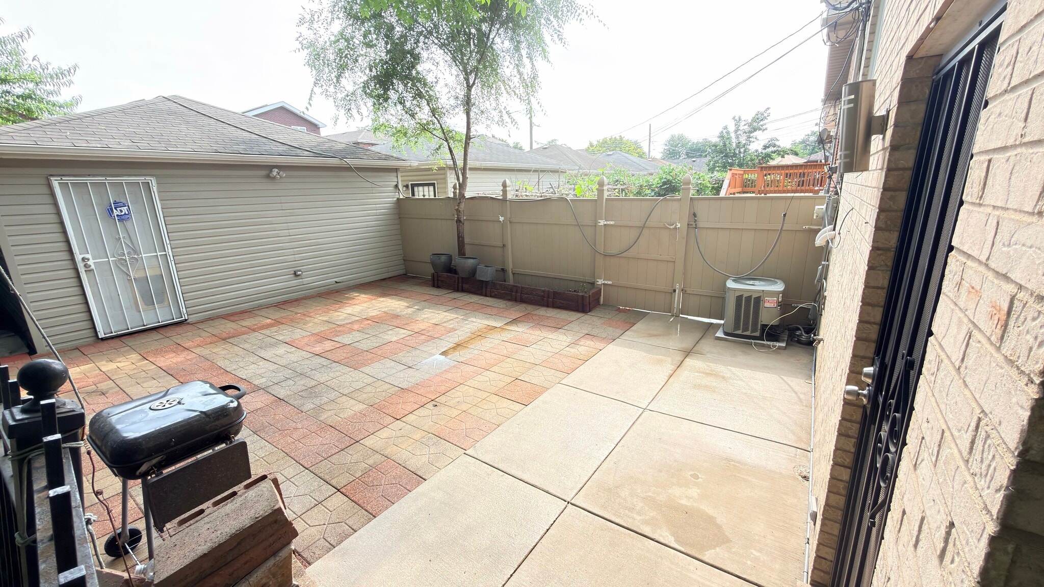 Patio has space for grill and outdoor furniture. - 419 W Root St