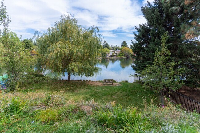 Building Photo - Private river access and stunning views from this home on Harmon Blvd! + Bonus Room