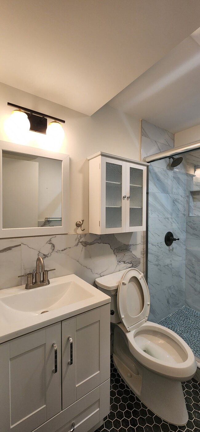 Bathroom with shower and luxury tiles - 2160 22nd Ave