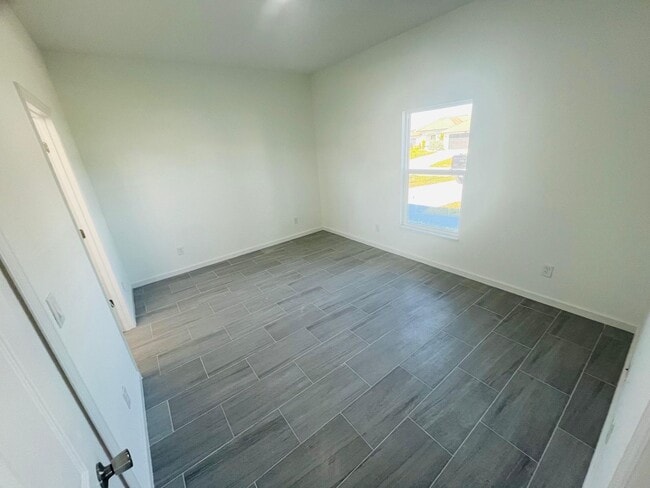 Building Photo - NEW CONSTRUCTION-  Modern 3 Bed / 2 Bath Home in Lehigh Acres