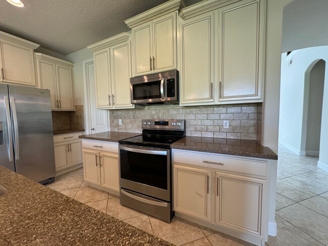 Building Photo - VillageWalk at Lake Nona ~ Gorgeous 4 bed/3 bath Executive Home!