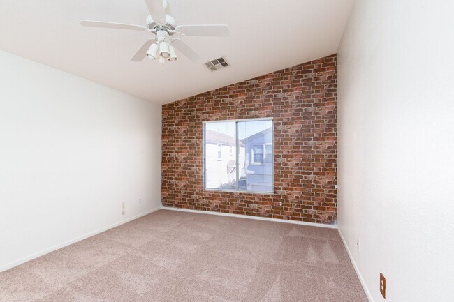 Building Photo - Two bedroom townhome with garage in gated ...