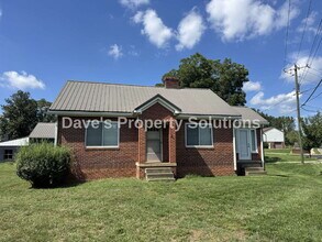 Building Photo - Spacious Living on ~1 Acre! | 3-Car Garage + Extra Covered Parking | Landscaping Included!