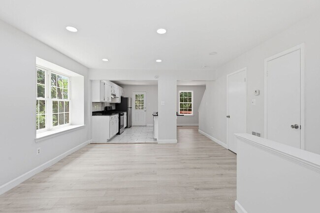 Building Photo - Experience contemporary living in this beautifully renovated residence where modern design meets ...